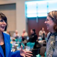 President Mantella speaking with Assistant Dean, Karen Ruedinger
